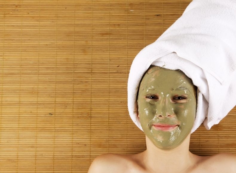 Woman applying homemade face masks to remove sun tan .DIY face packs for sun tan removal