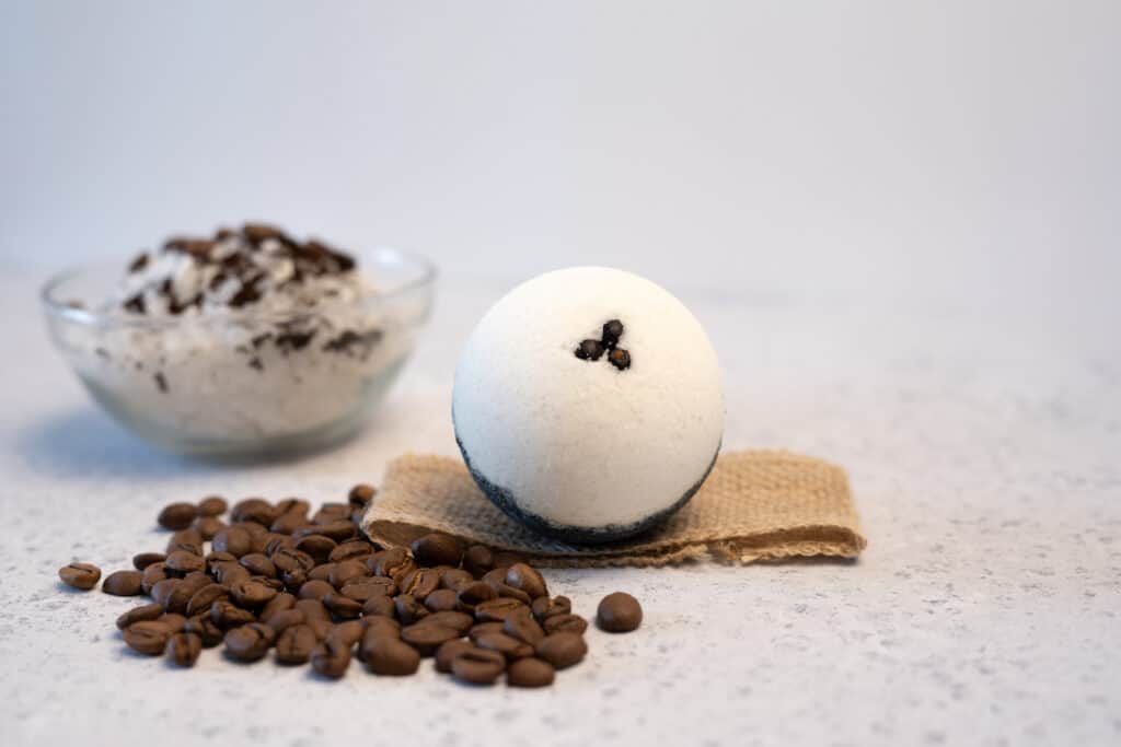 coffee Bath bombs with coffee grains on a white background.